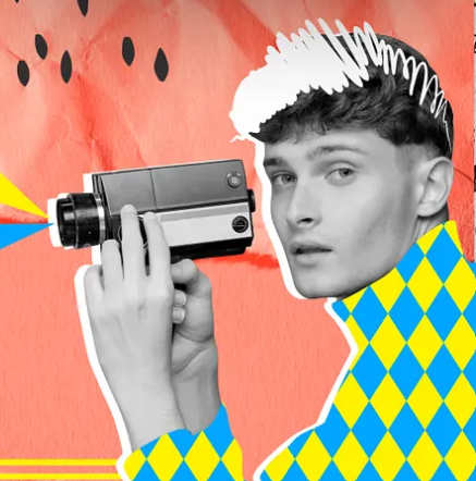 A man is holding Camera